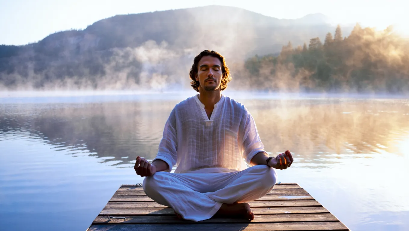 Person in peaceful meditation pose representing calm and balanced state